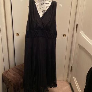 Francy black dress with straps that tie around the neck.